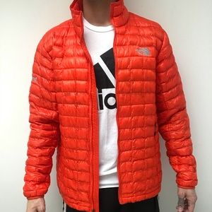 Orange North Face puffer jacket